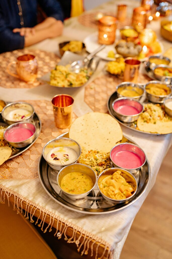 pexels photo 8818732 8818732 A vibrant spread of traditional Indian dishes on a festive dinner table.